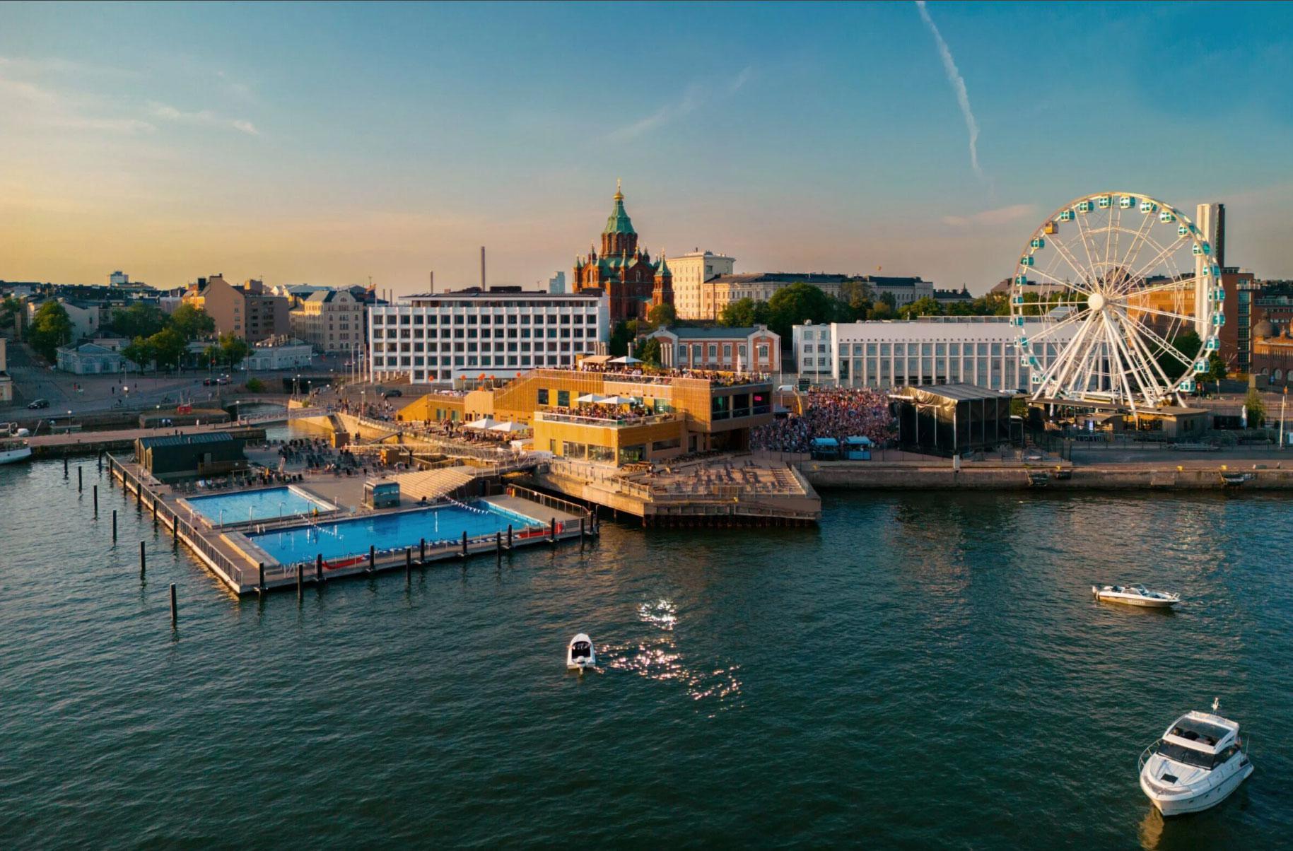 Allas Pool, view from the sea. Next to the building, there are swimming pools.