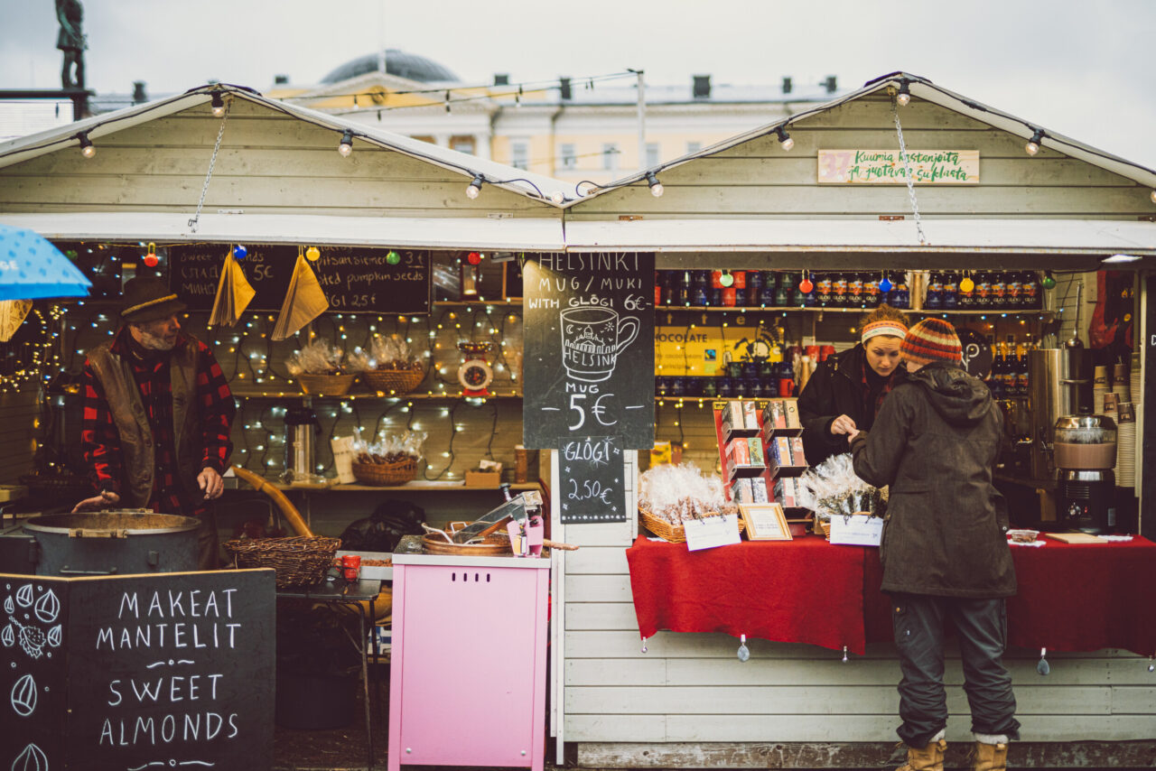 Men in booths at Christmas market in Helsinki