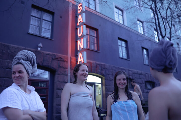 Girls cooling off outside Kotiharjun sauna in Helsinki