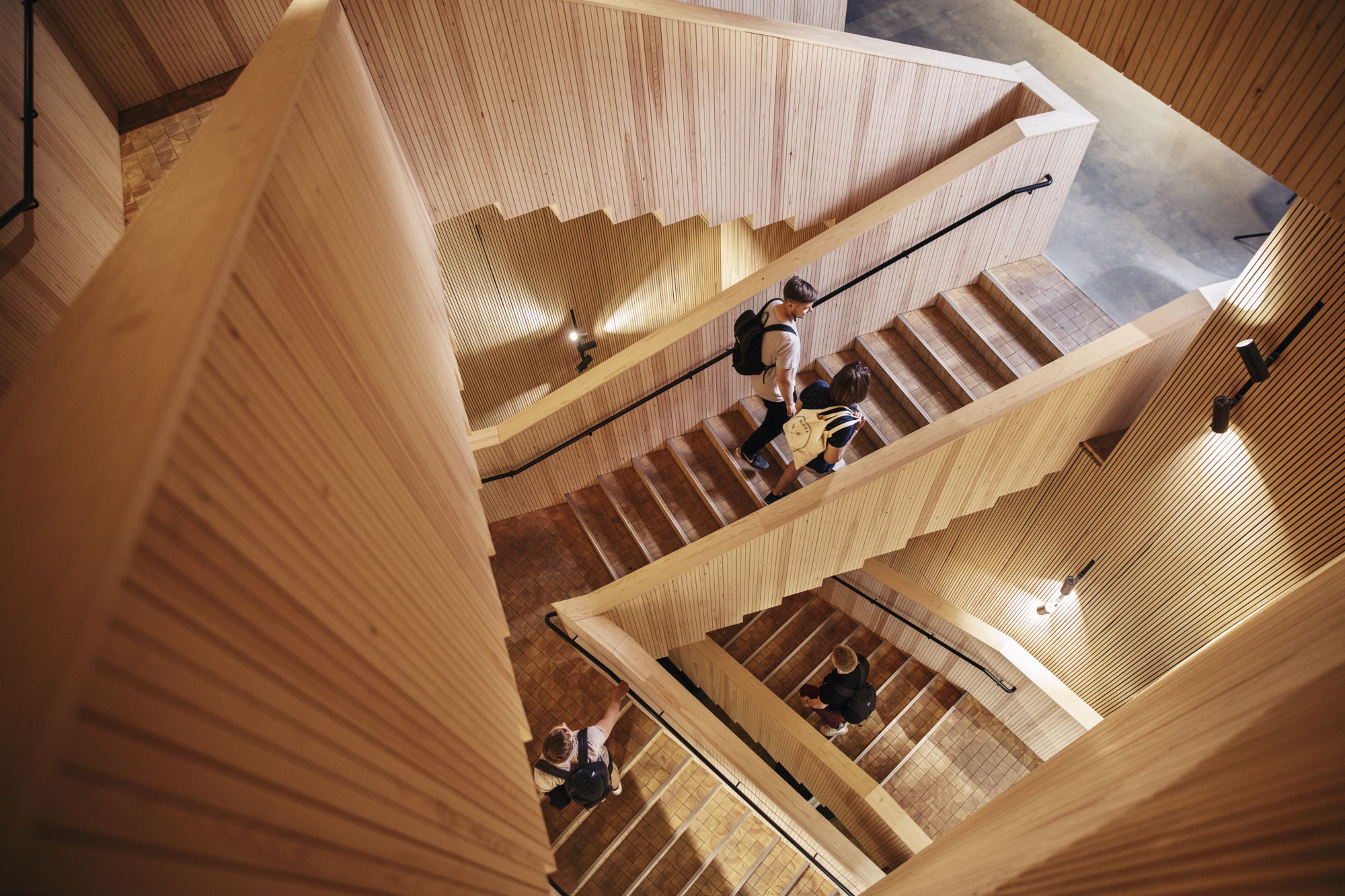 people walking up the stairs at Helsinki Think Corner in Helsinki University. Study in Helsinki and find this staircase