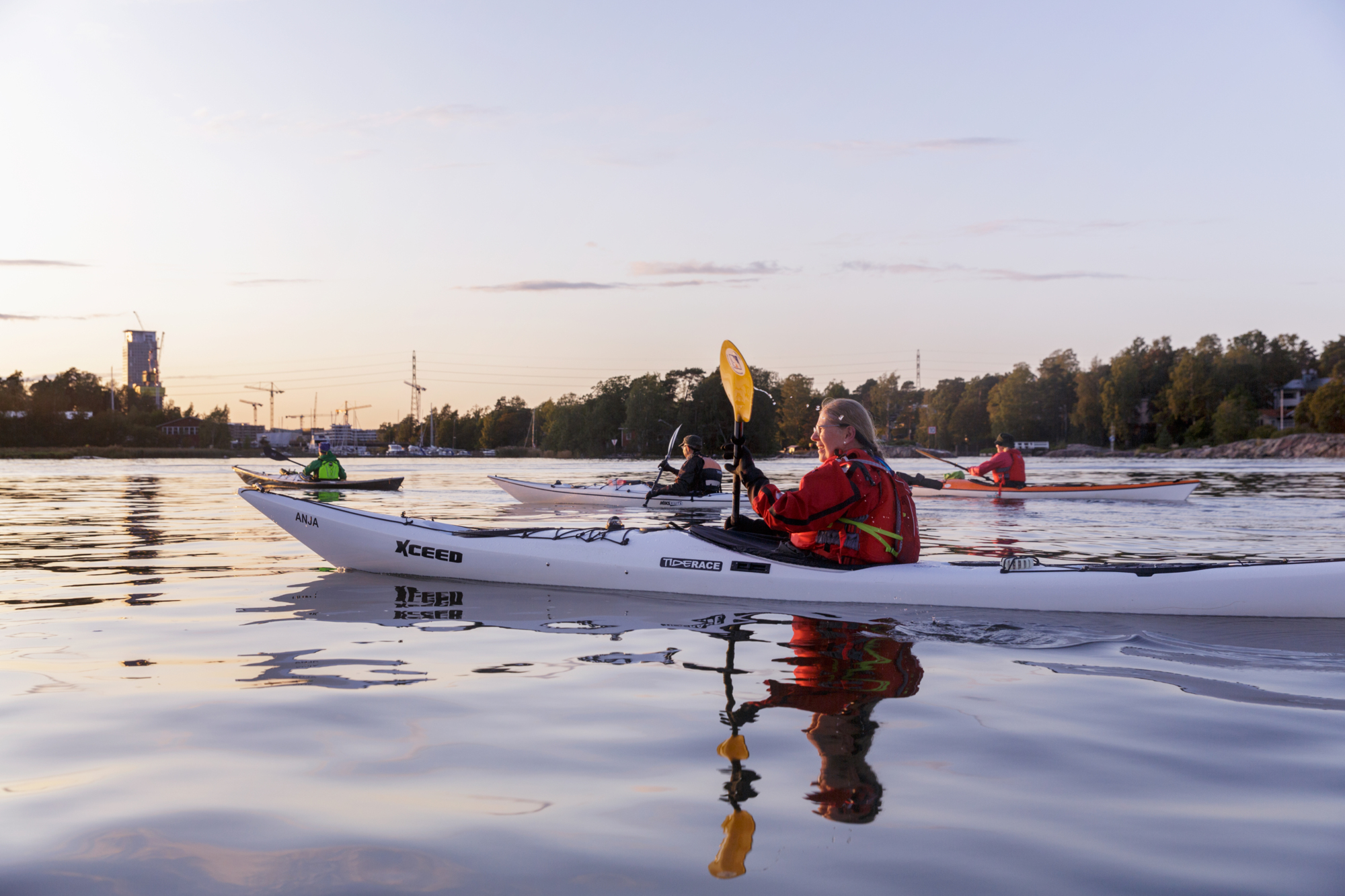 A group of canoeist getting around Helsinki