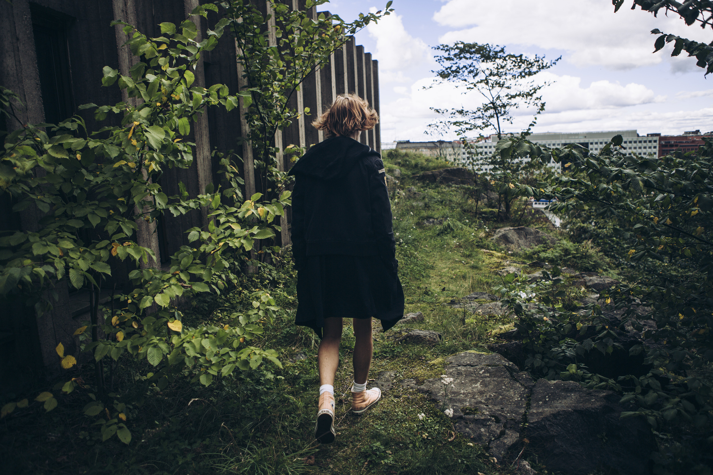 Person walking in Helsinki urban nature