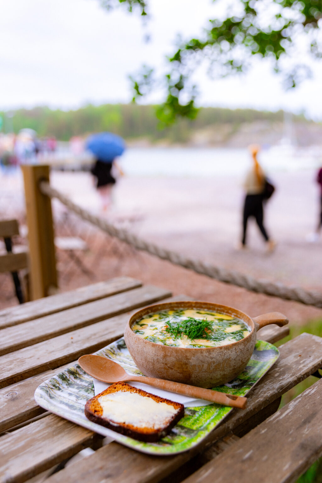 a bowl of salmon soup on a table