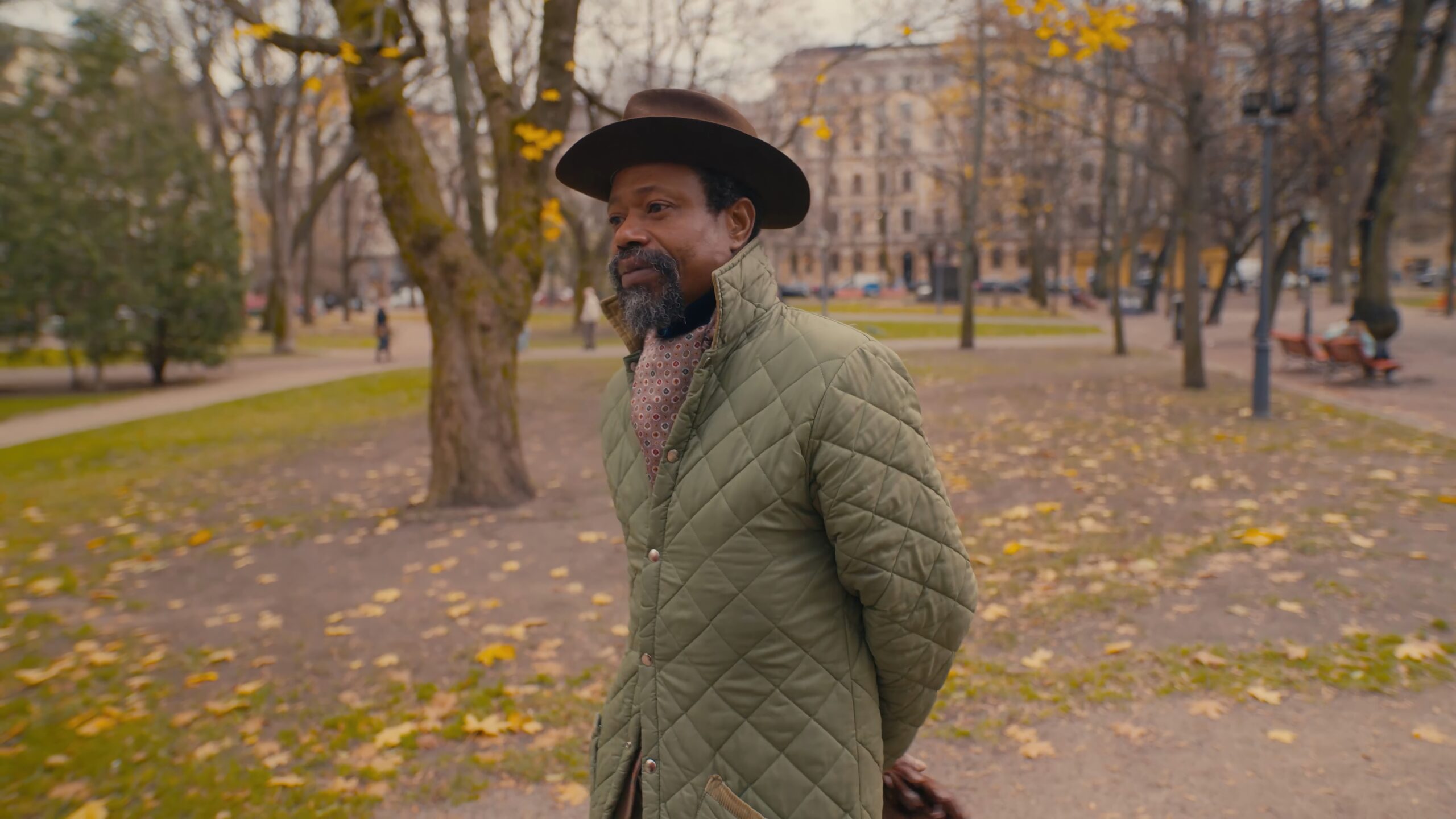 a man in a hat and coat