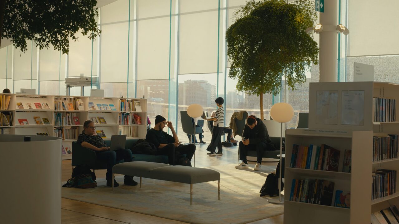 a group of people sitting in a library