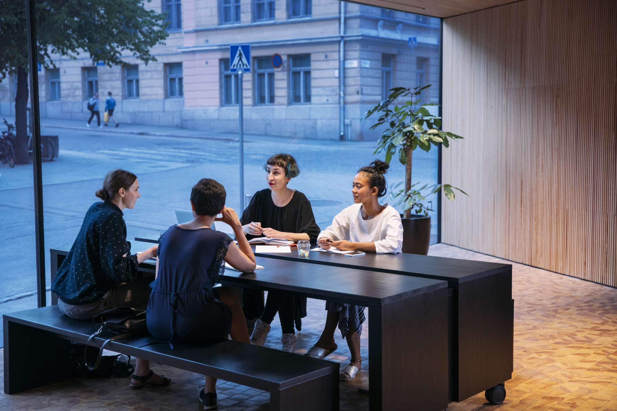 a group of people sitting at a table at Helsinki 24/7 - Helsinki University Think Corner